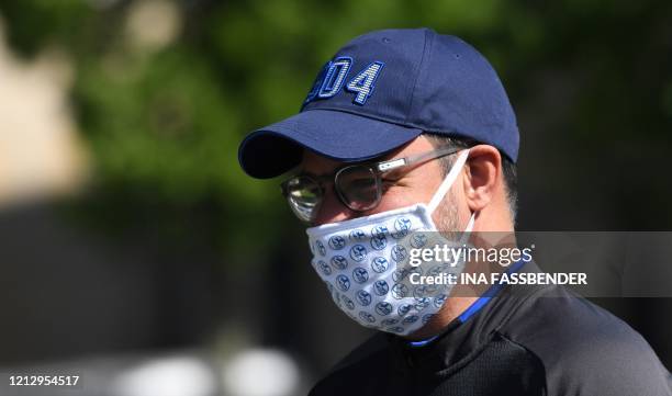 Schalke 04's German headcoach David Wagner walks with a face mask from the hotel, where the team stays in quarantine, to the club's training grounds...