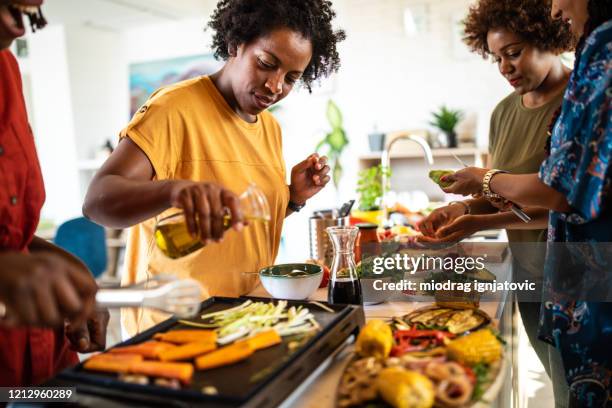 making lunch together - vegetarian meal stock pictures, royalty-free photos & images