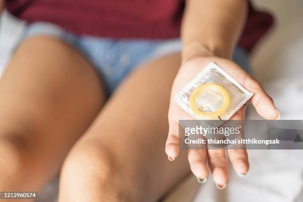 condom for safe sex and prevent pregnancy concept - condon fotografías e imágenes de stock