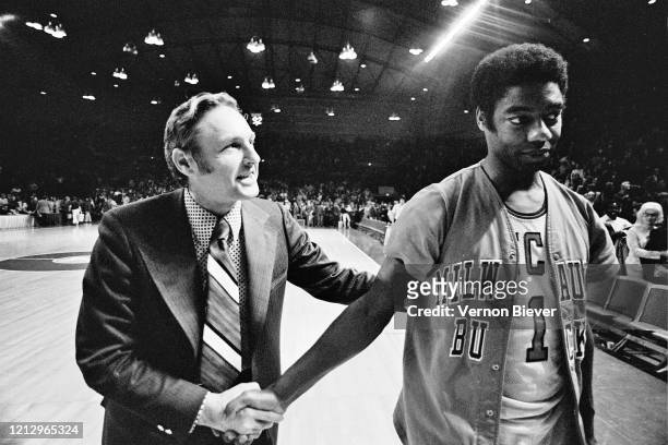 Head coach Larry Costello of Milwaukee Bucks and Oscar Robertson of Milwaukee Bucks talks during the game against the Los Angeles Lakers circa 1973...