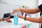 Hand pushing or pumping algohol gel for wash , cleaning hands from virus, bacteria, for good hygiene stock photo