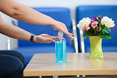 Hand pushing or pumping algohol gel for wash , cleaning hands from virus, bacteria, for good hygiene stock photo
