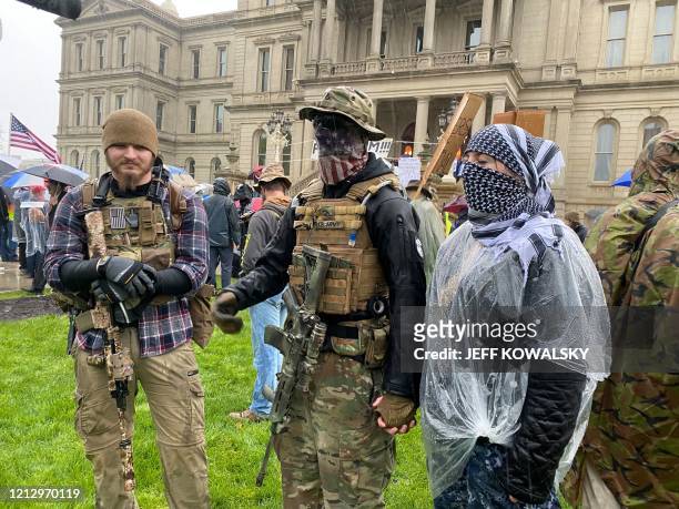 Armed demonstrators protest in Lansing, Michigan, during a rally organized by Michigan United for Liberty on May 14 to protest the coronavirus...