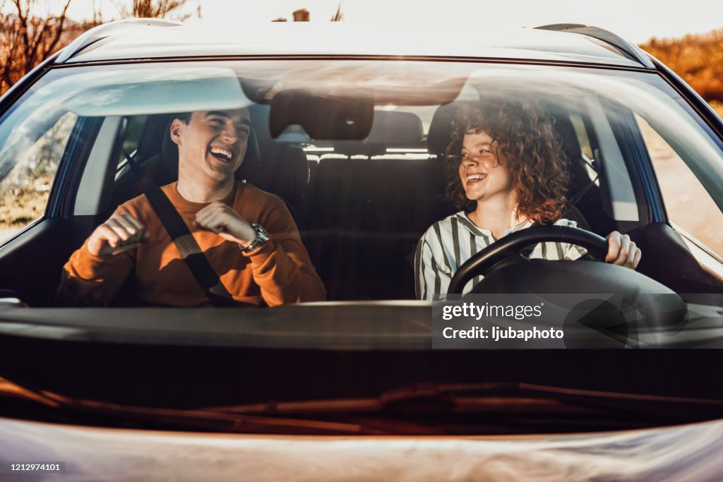 Happy young couple enjoying in drive