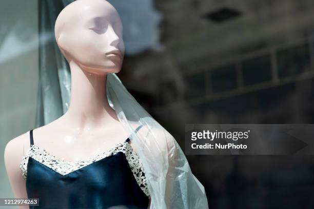 Woman dummy in a close dress shop in the city center of Roma during the Fase 2 , after the lockdown of the nation due to the Covid-19 outbreak, Roma,...