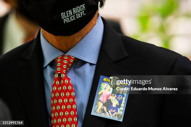 Man attends the funeral of Glen Ridge Police Officer Charles Roberts after he passed away from the coronavirus, on May 14, 2020 in Glen Ridge, New...