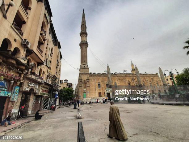 Few people walk in the area around the closed Hussein Mosque because of the spread of the Coronavirus, Cairo, Egypt, May 14, 2020