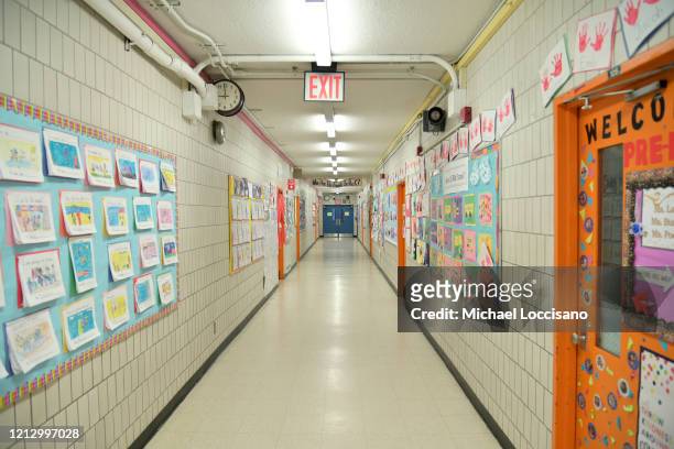 Hallway is empty on what would otherwise be a school day as teachers and faculty members learn remote teaching and methods for students at Yung Wing...