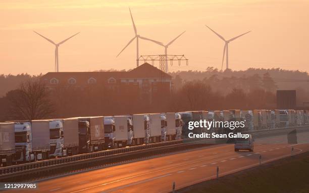 Trucks stand in a line stretching over 40km on the A12 highway towards Germany's border to Poland on March 17, 2020 near Frankfurt , Germany. The...