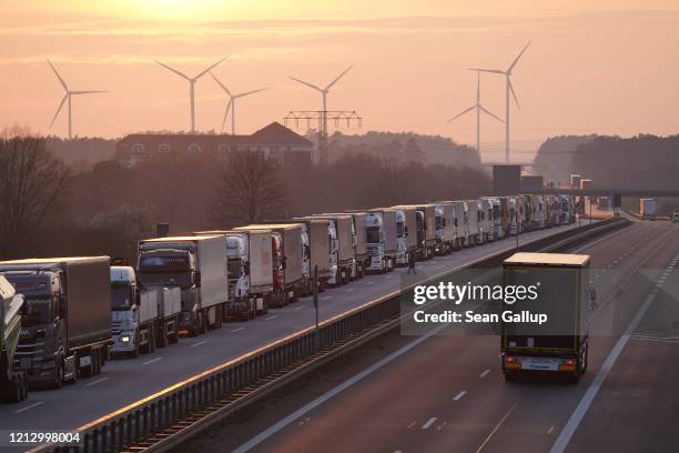 Trucks stand in a line stretching over 40km on the A12 highway towards Germany's border to Poland on March 17, 2020 near Frankfurt , Germany. The...