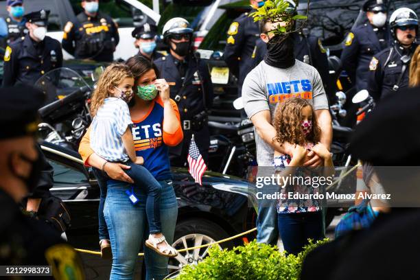 Residents attend the funeral of Glen Ridge Police Officer Charles Roberts after he passed away from the coronavirus, on May 14, 2020 in Glen Ridge,...