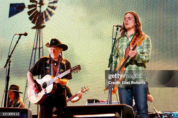 Willie Nelson and Lukas Nelson performing at the Farm Aid Concert at LiveStrong Sporting Park on August 13, 2011 in Kansas City, Kansas.