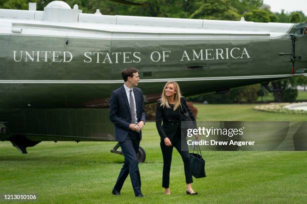 White House advisor Jared Kushner talks with White House Press Secretary Kayleigh McEnany as they exit Marine One and walk toward the White House on...