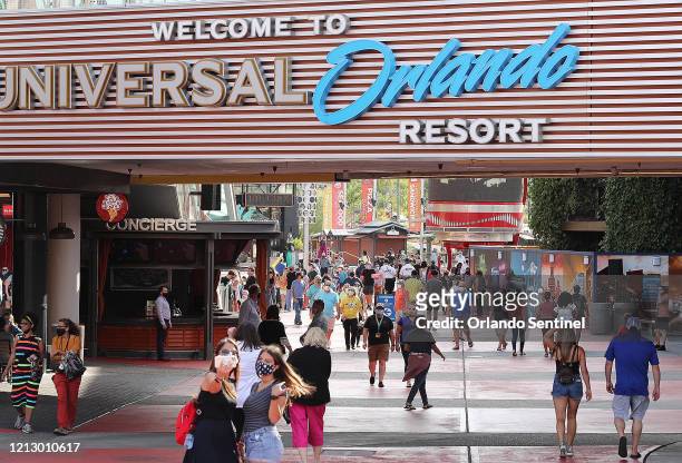 Guests enjoy themselves at Universal CityWalk in Orlando, Fla., on Thursday, May 14, 2020. Universal began limited operation of select venues at...