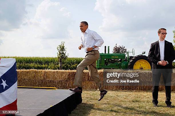 President Barack Obama arrives to speak at a town hall style meeting at Country Corner Farm Market on August 17, 2011 in Alpha, Illinois. President...