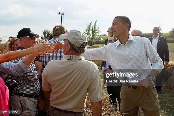 President Barack Obama shakes hands with people after speaking at a town hall style meeting at Country Corner Farm Market on August 17, 2011 in...