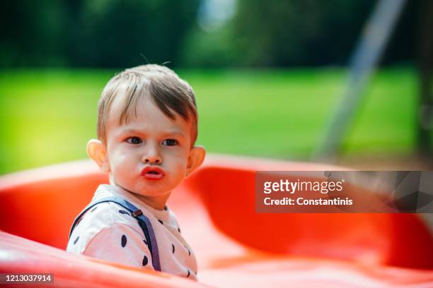 little boy is having fun at playground. - amber alert stock pictures, royalty-free photos & images