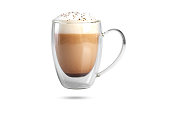 cappuccino with cinnamon on a foam in a transparent cup with a double bottom. isolate on white background