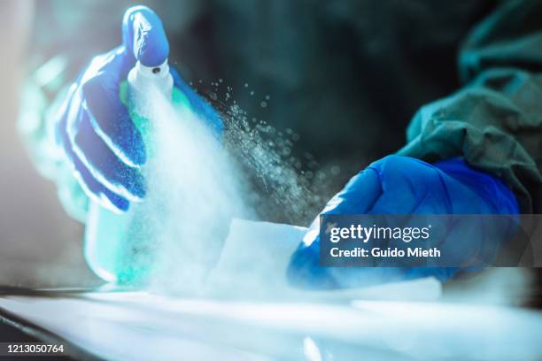 spraying disinfection on surface. - líquido de limpeza imagens e fotografias de stock