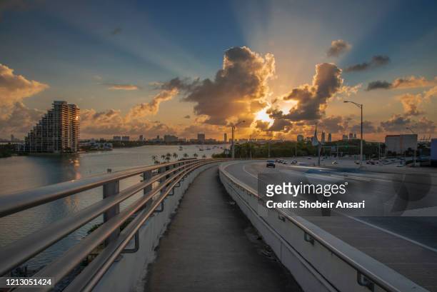 on top of macarthur causeway at sunrise, miami, florida - florida bridge stock pictures, royalty-free photos & images