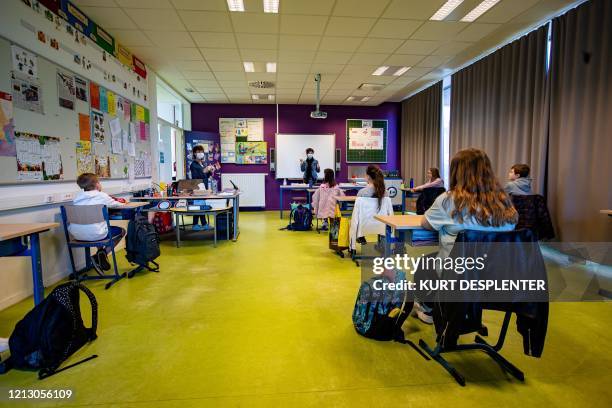 Pupils attend a class at Basisschool De Valke in Lichtervelde on May 15, 2020 as schools test the re-opening and start again for a limited number of...