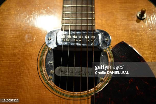 Detail of the guitar used by musician Kurt Cobain during Nirvana's famous MTV Unplugged in New York concert in 1993, is pictured at the Hard Rock...