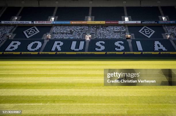 Greenkeeper of Borussia Moenchengladbach prepares the pitch of Borussia-Park on May 15, 2020 in Moenchengladbach, Germany.