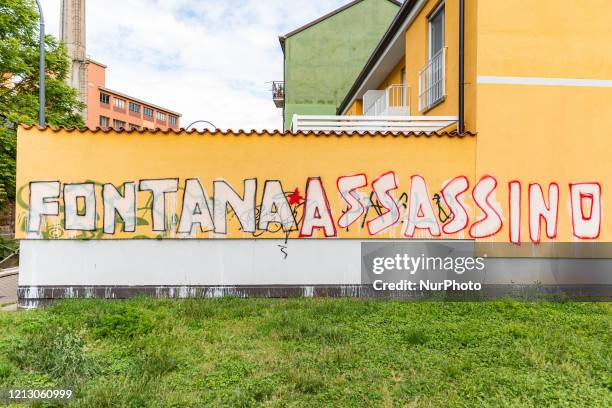 Fontana assassino&quot; is the graffito that appeared on a wall of a building in Via Vittorelli claimed by the party P.CARC during the Coronavirus...