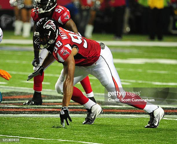 Cliff Matthews of the Atlanta Falcons rushes the passer against the Miami Dolphins during a preseason game at the Georgia Dome on August 12, 2011 in...