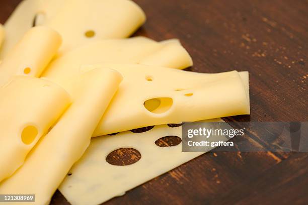 formaggio a fette - swiss cheese foto e immagini stock