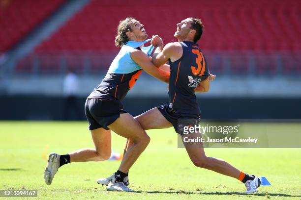 Phil Davis of the Giants and Jeremy Finlayson of the Giants during a Greater Western Sydney Giants AFL training session at GIANTS Stadium on March...