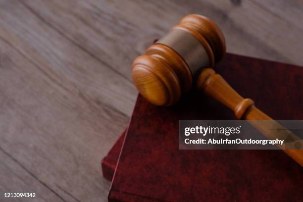 judge gavel with books on wooden table - australian politics stock pictures, royalty-free photos & images