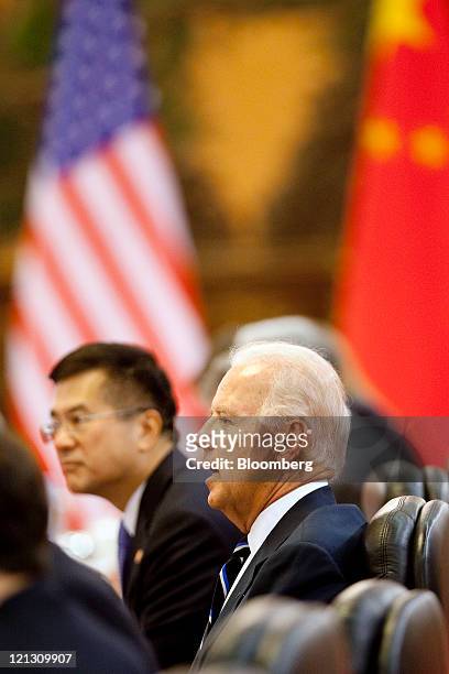 Joe Biden, U.S. Vice president, right, and Gary Locke, U.S. Ambassador to China, hold a bilateral meeting with Xi Jinping, China's vice-president,...