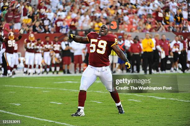 **one of three** LANDOVER, MD. August, 12 : on August 2011 in Landover, Md.Washington Redskins linebacker London Fletcher celebrates after helping to...