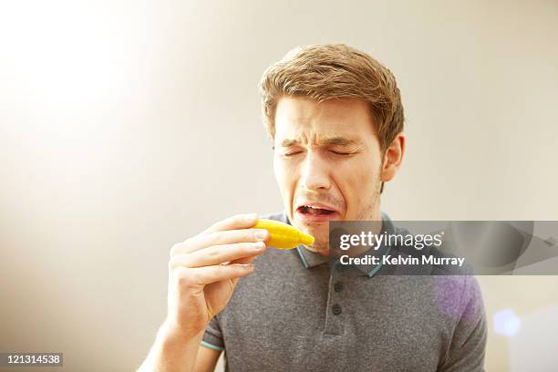 pleasure / pain - gurning stock pictures, royalty-free photos & images