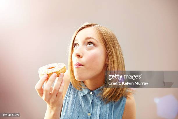 pleasure / pain - donut stock pictures, royalty-free photos & images