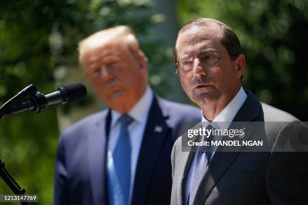 Secretary of Health and Human Services Alex Azar, with US President Donald Trump, speaks on vaccine development on May 15 in the Rose Garden of the...