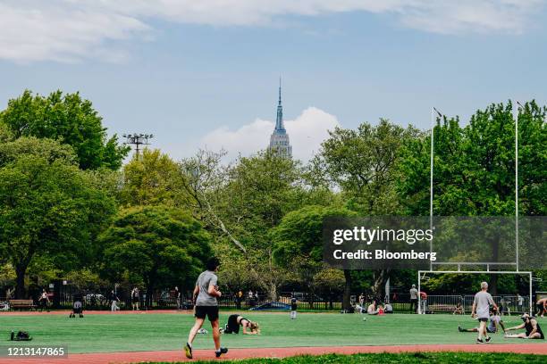 People exercising at McCarren Park in the Brooklyn Borough of New York, U.S., on Friday, May 15, 2020. Mayor Bill de Blasio says the city along with...