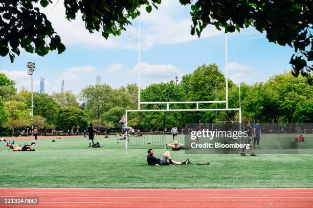 People exercise on the field at McCarren Park in the Brooklyn Borough of New York, U.S., on Friday, May 15, 2020. Mayor Bill de Blasio says the city...