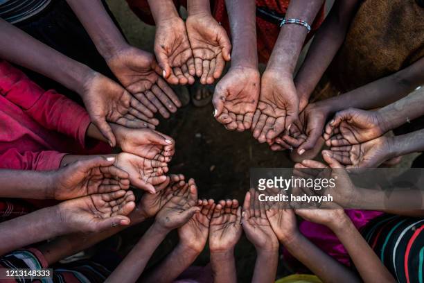 hands of poor - asking for help, africa - sudanese girls stock pictures, royalty-free photos & images