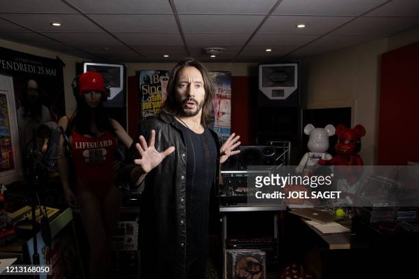 French 'house music' DJ Christophe Le Friant better known by his stage name Bob Sinclar poses in his studio during a photo session in Paris, on May...