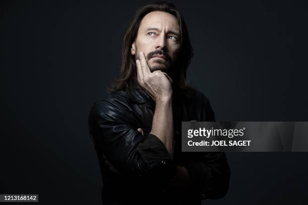 French 'house music' DJ Christophe Le Friant better known by his stage name Bob Sinclar poses in his studio during a photo session in Paris, on May...