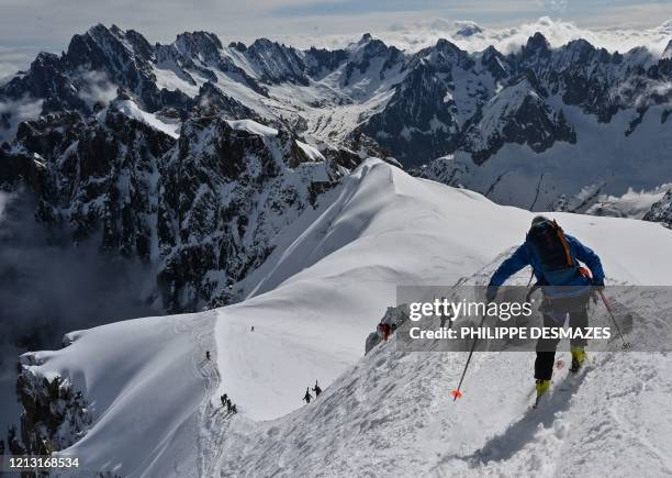 Mountaineers ski to the 'Vallee Blanche' a glacial valley located in the Mont-Blanc massif, from the 'Aiguille du Midi' peak in Chamonix, on May 16...