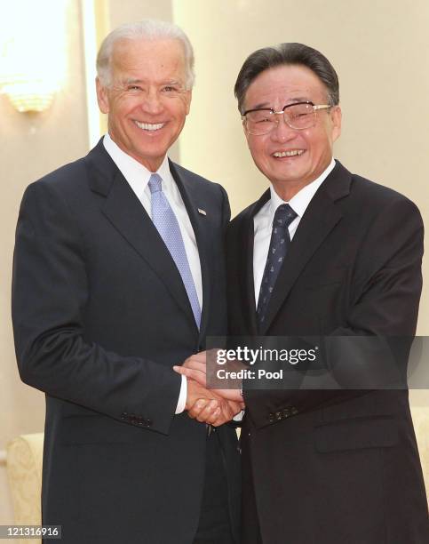 Vice President Joe Biden is greeted by Chinese National Peoples Congress Standing Committee Chairman Wu Bangguo ahead of their meeting at the Great...