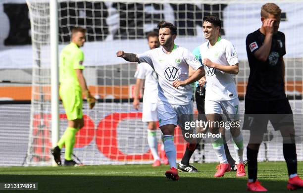 Renato Steffen of VfL Wolfsburg celebrates after scoring their team's first goal during the Bundesliga match between FC Augsburg and VfL Wolfsburg at...