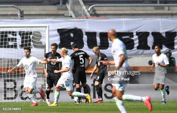 Renato Steffen of VfL Wolfsburg celebrates with teammate Xaver Schalger after scoring their team's first goal during the Bundesliga match between FC...