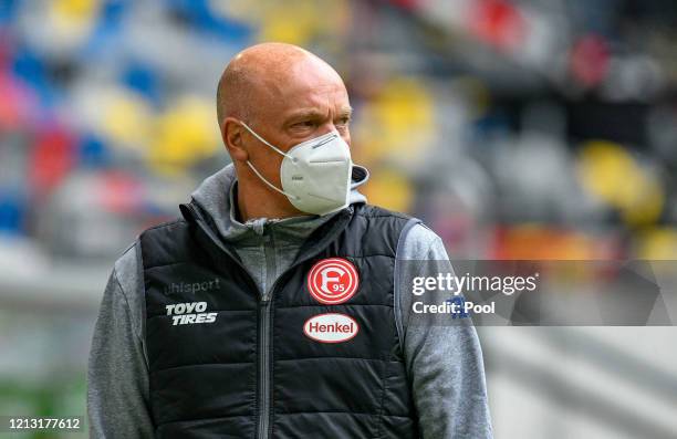 Uwe Roesler, Manager of Fortuna Duesseldorf looks on while wearing a face mask prior to the Bundesliga match between Fortuna Duesseldorf and SC...