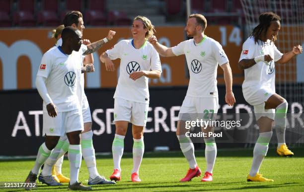 Jerome Roussillon, Daniel Ginczek, Felix Klaus, Maximilian Arnold and Kevin Mbabu of VfL Augsburg celebrate after Daniel Ginczek scored their team's...