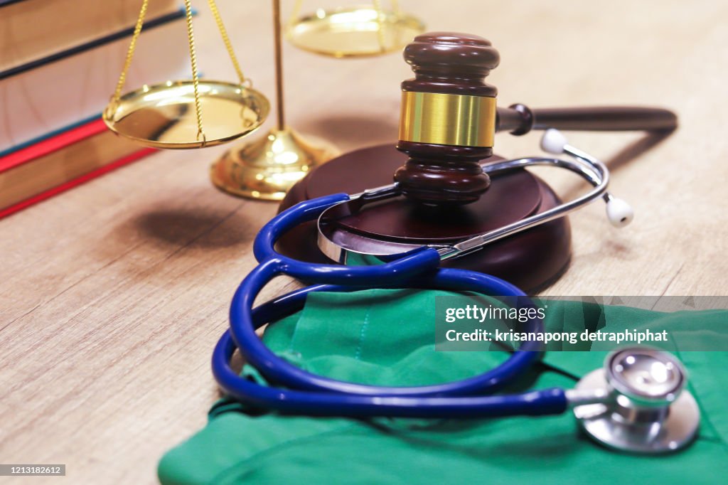 Medical law concept,Gavel and stethoscope in background. Medical laws and legal concept.