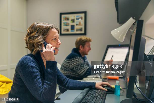 couple working from home - social distancing in office stock pictures, royalty-free photos & images